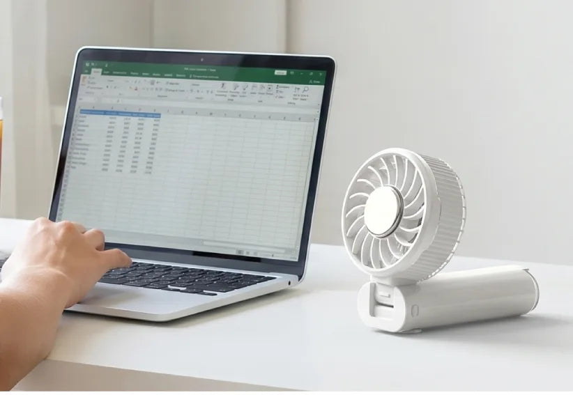 Airdog F200 folded into a desk fan next to a laptop at work