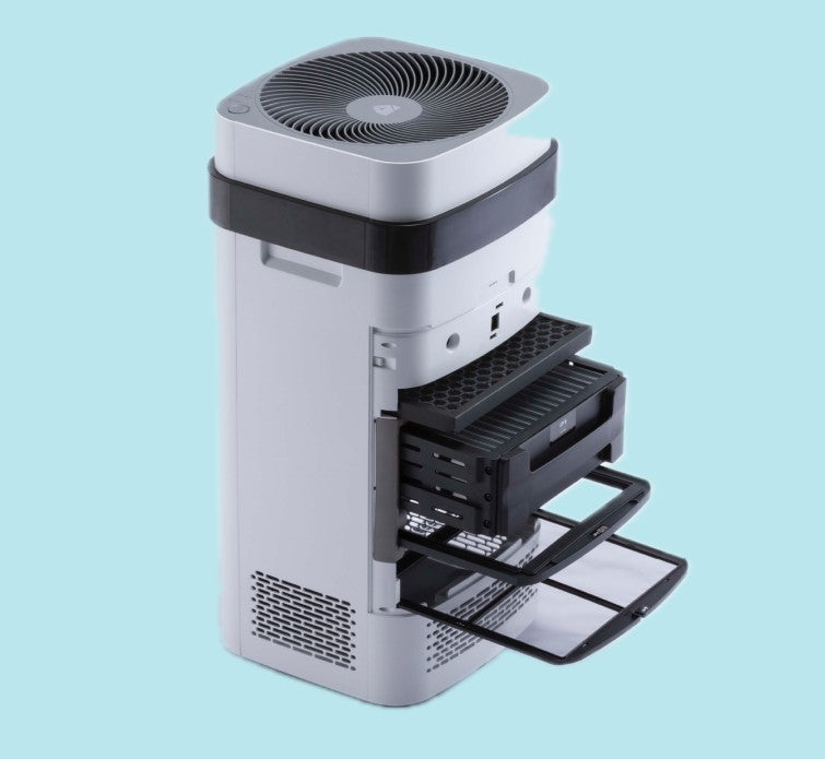 The AirSoap X8 with its back cover open, showing the slide-out TPA filter trays