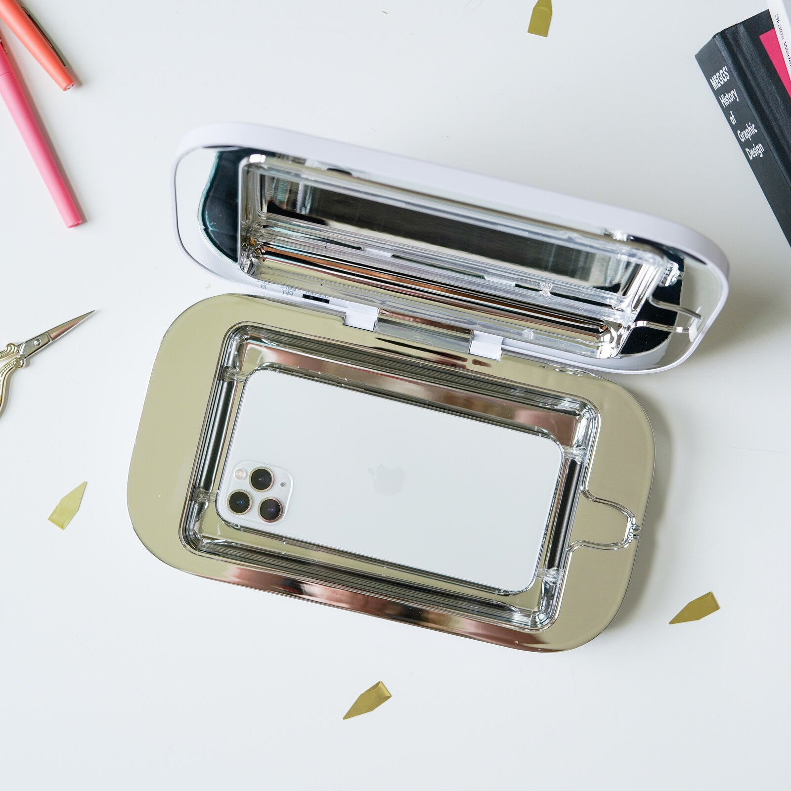 Overhead view of the open PhoneSoap Pro with an iPhone inside the oversized chamber