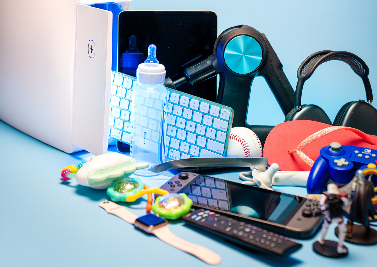 The shared household items a UV sanitizer can clean: tablets, remotes, controllers, keyboards, bottles and toys