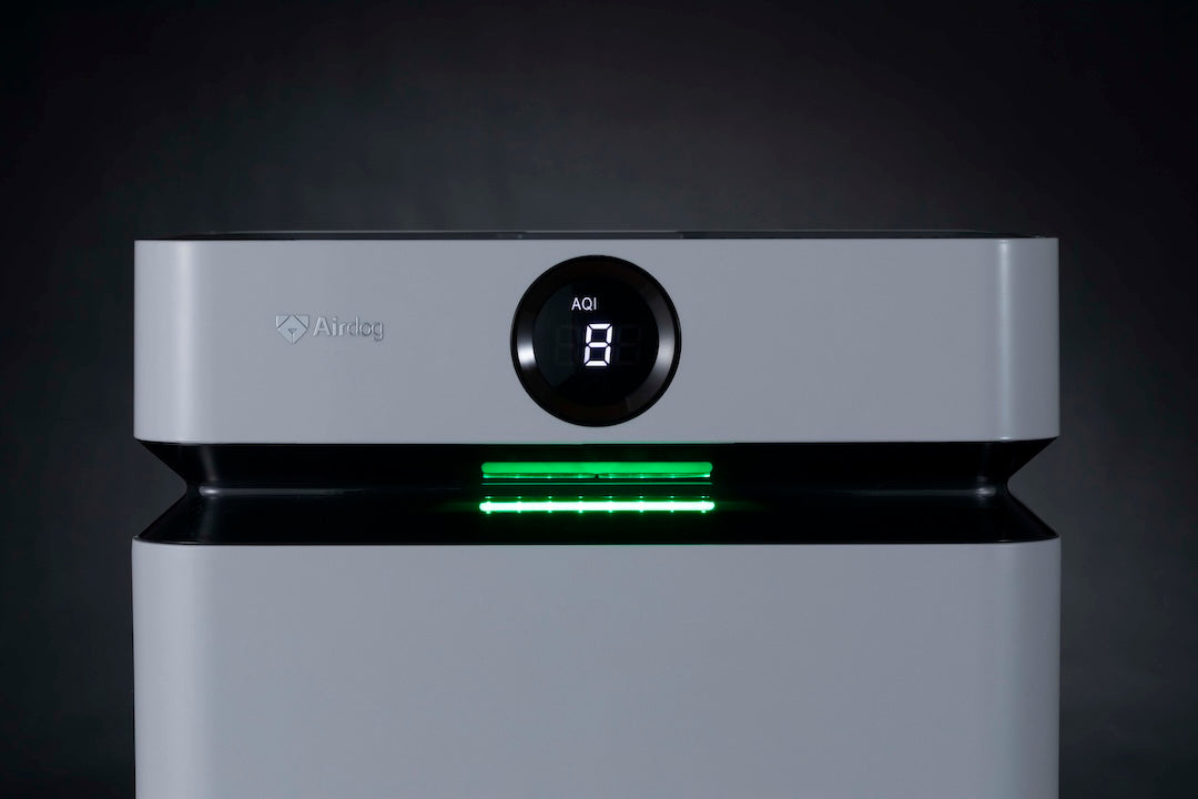 Front view of the AirSoap X8 showing the green status light and the air-quality readout